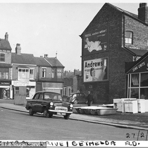Street corner, with Bethesda Salerooms on the right with bathroom supplies on the forecourt.