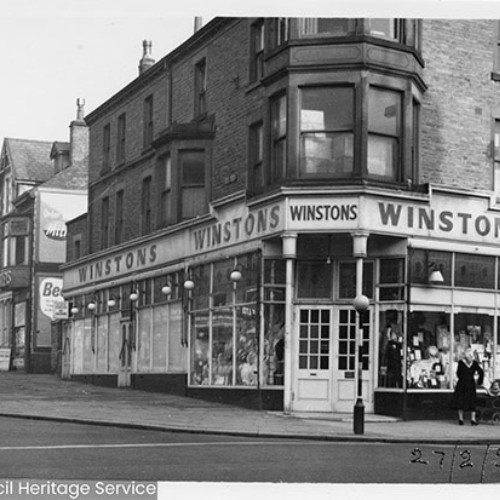 Street corner, with the shop front of Winstons.