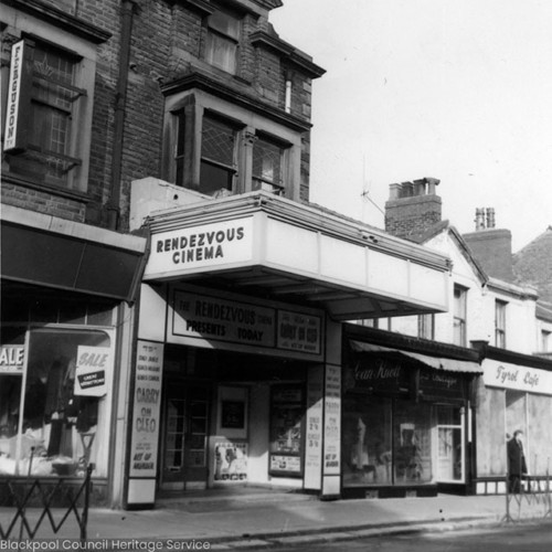 Exterior of the Rendezvous Cinema, with film posters advertising Carry On Cleo.