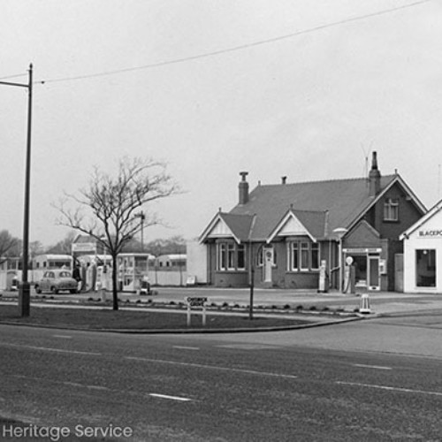 Blackpool Service Station, with a man filling a car at the petrol pumps.