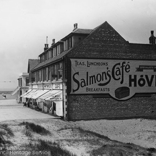 Row of shops, including Salmon's Cafe on the end which advertises Teas, Luncheons, Breakfasts, Specialists in Hovis.