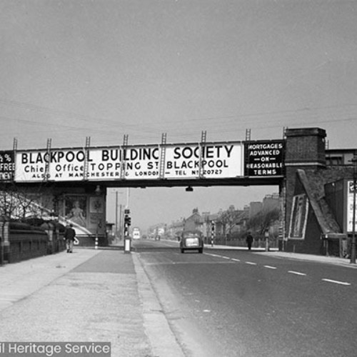 Bridge over the road, which is covered in advertising for the Blackpool Building Society.