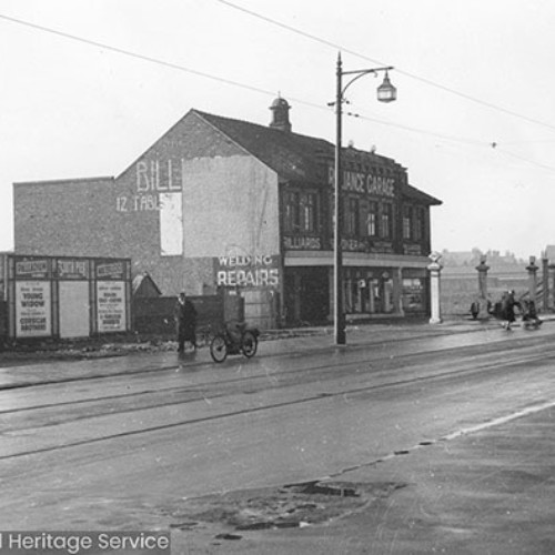 Reliance Garage, with the road in front with a small delivery lorry on it.