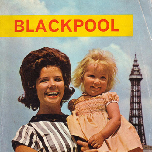Guide book cover with photograph of woman and child on Blackpool beach