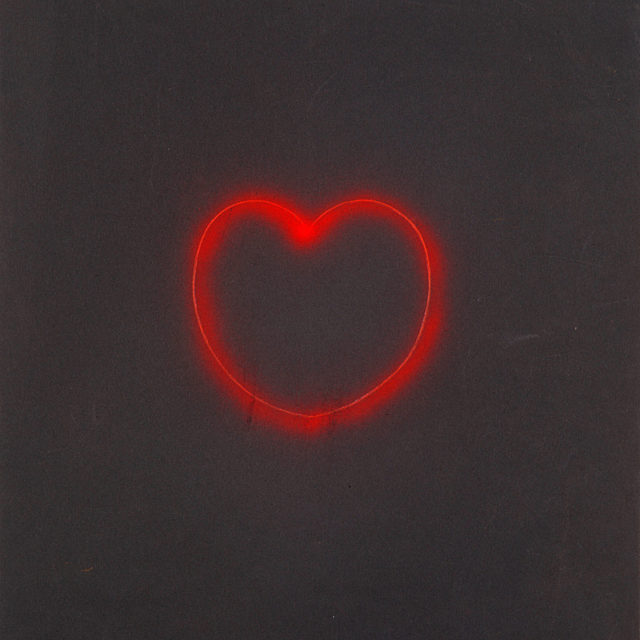 Concept design on black paper for a neon installations in the shape of playing card suit, a heart in red