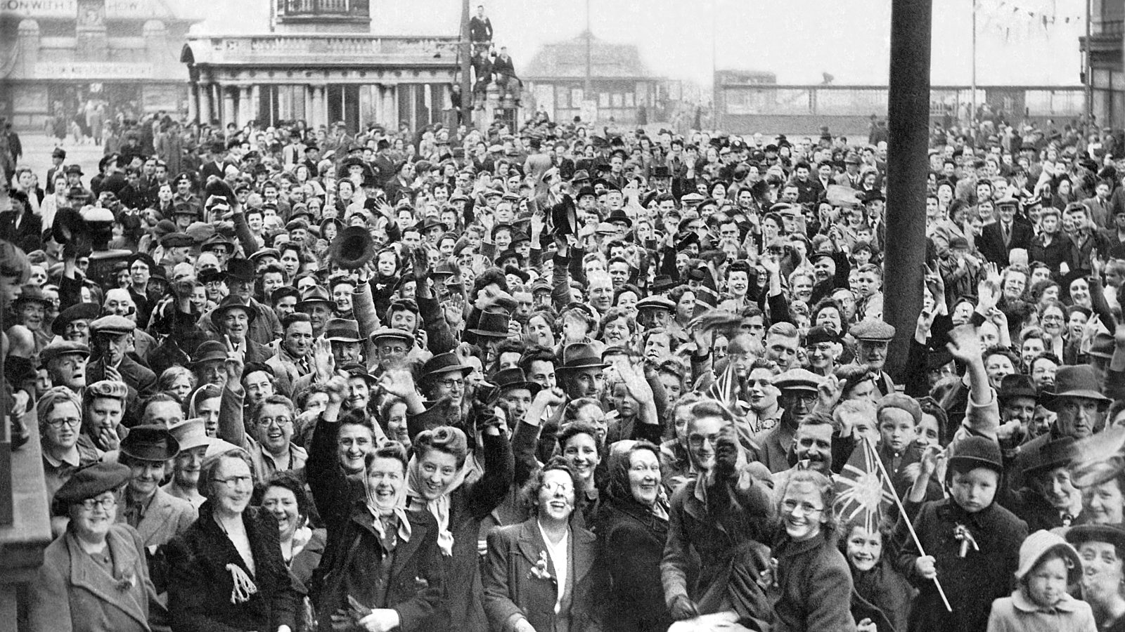 Close up of crowds celebrating with North Pier in the background