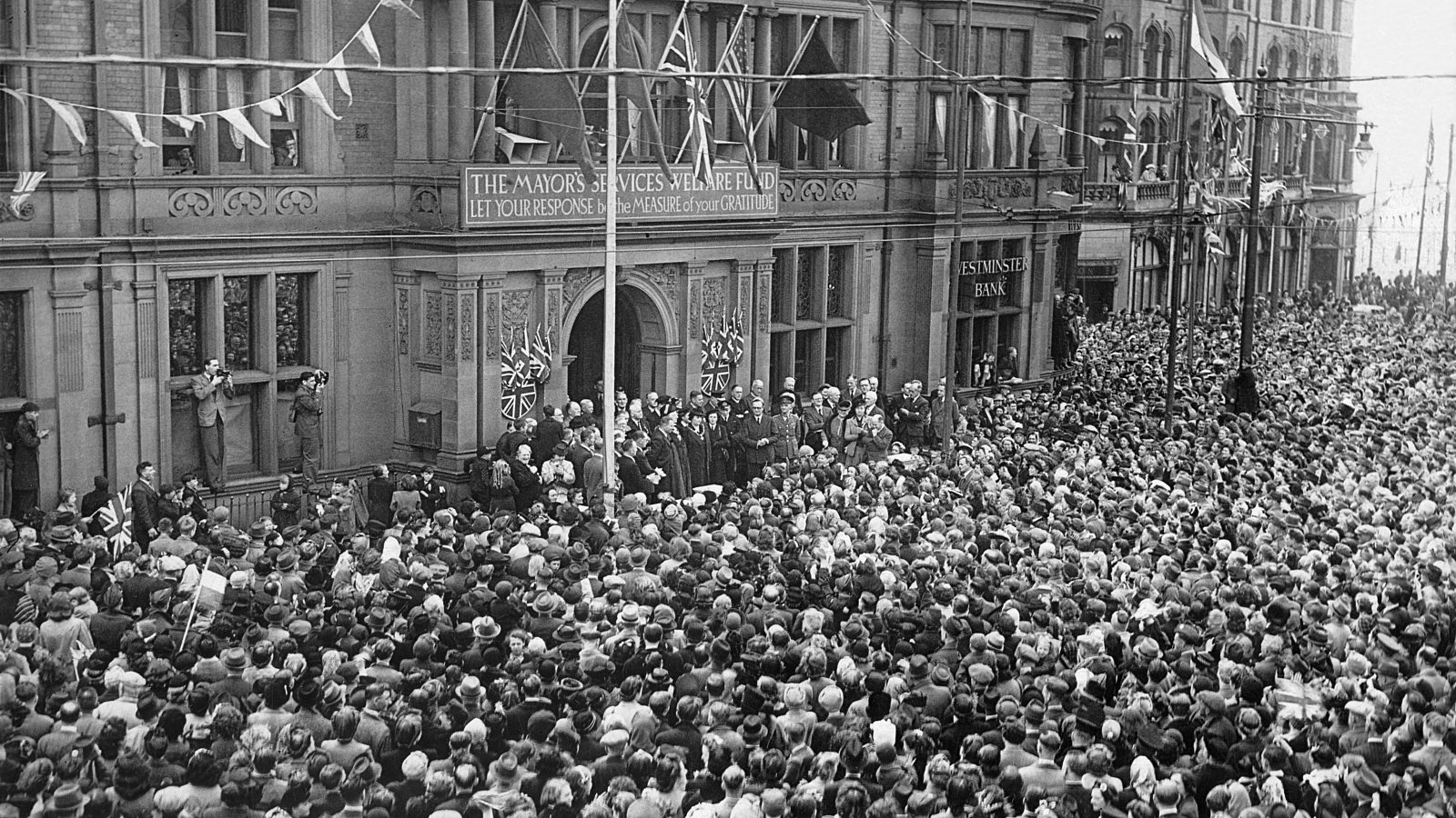 Crowds of people celebrating outside of Blackpool Town Hall