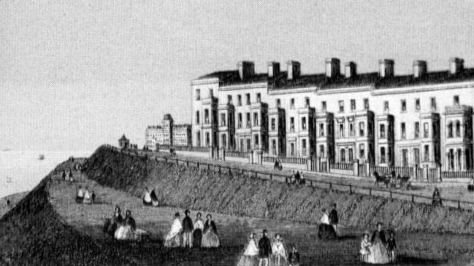 An etching of seafront buildings with people walking on a promenade in the foreground.