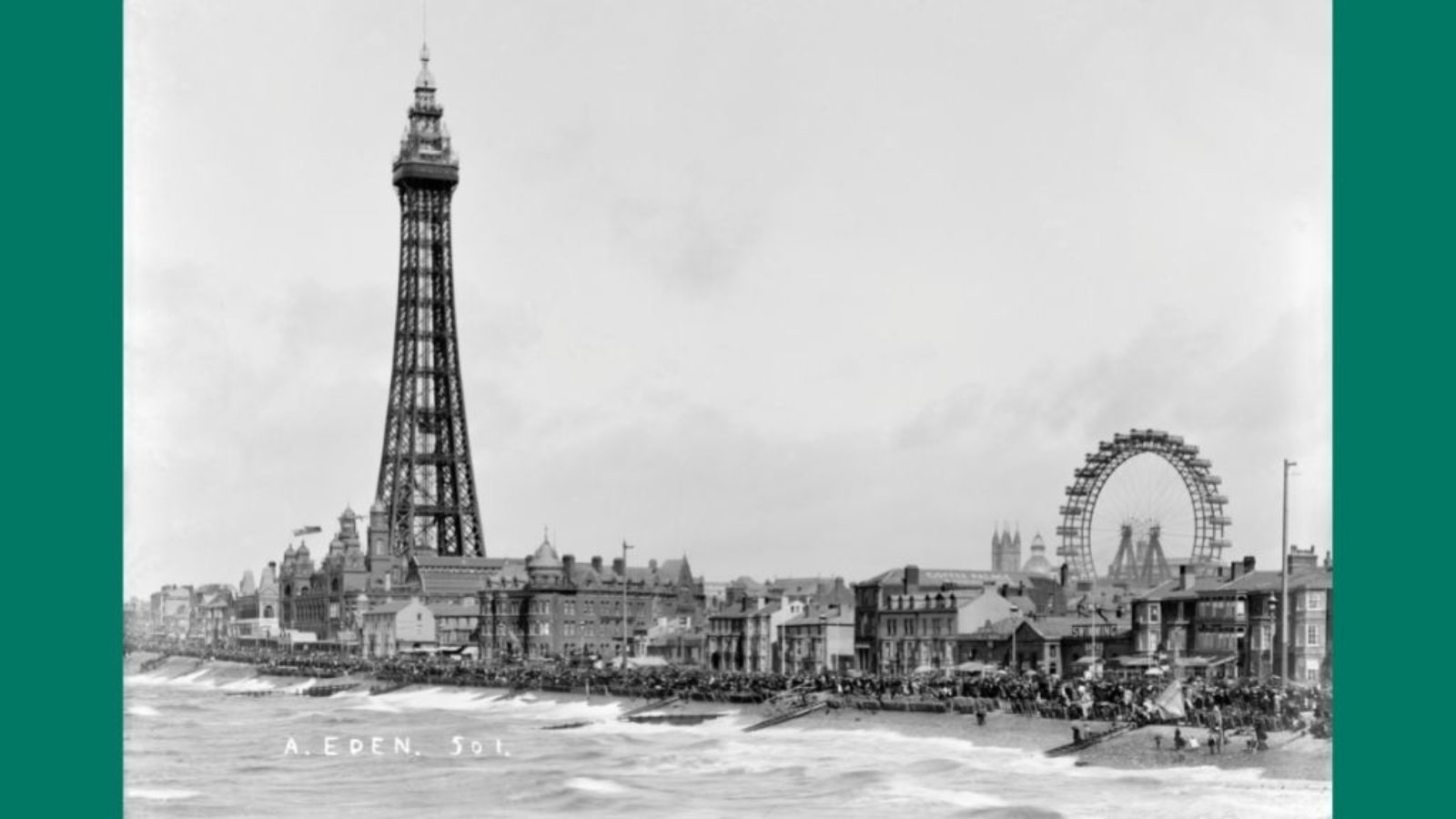 View across Blackpool Seafront with the Tower in foreground and Ferris wheel in background.