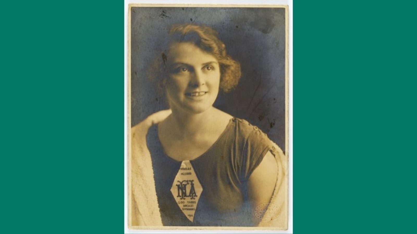 A portrait of a young woman in a swimming costume