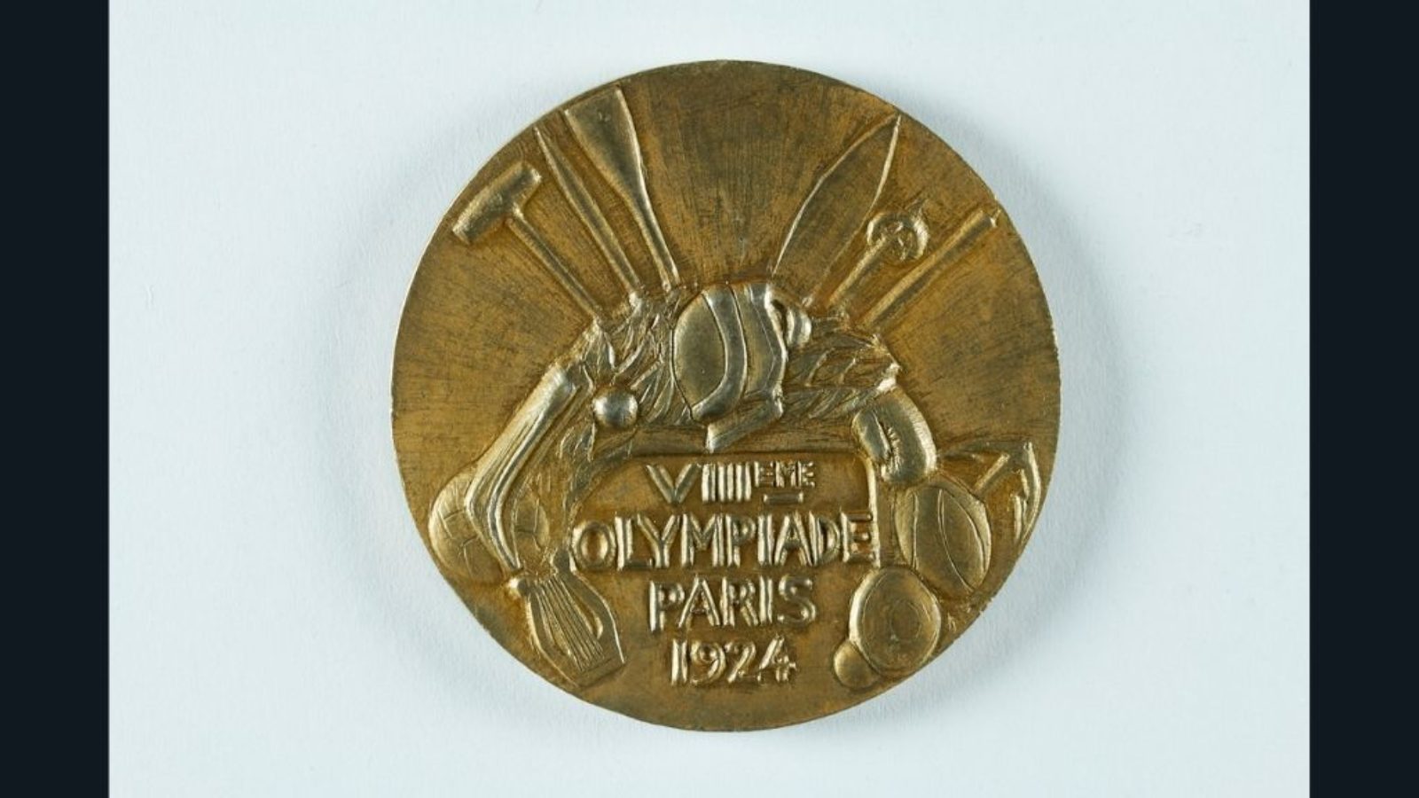 A close up of an Olympic gold medal from Paris 1926