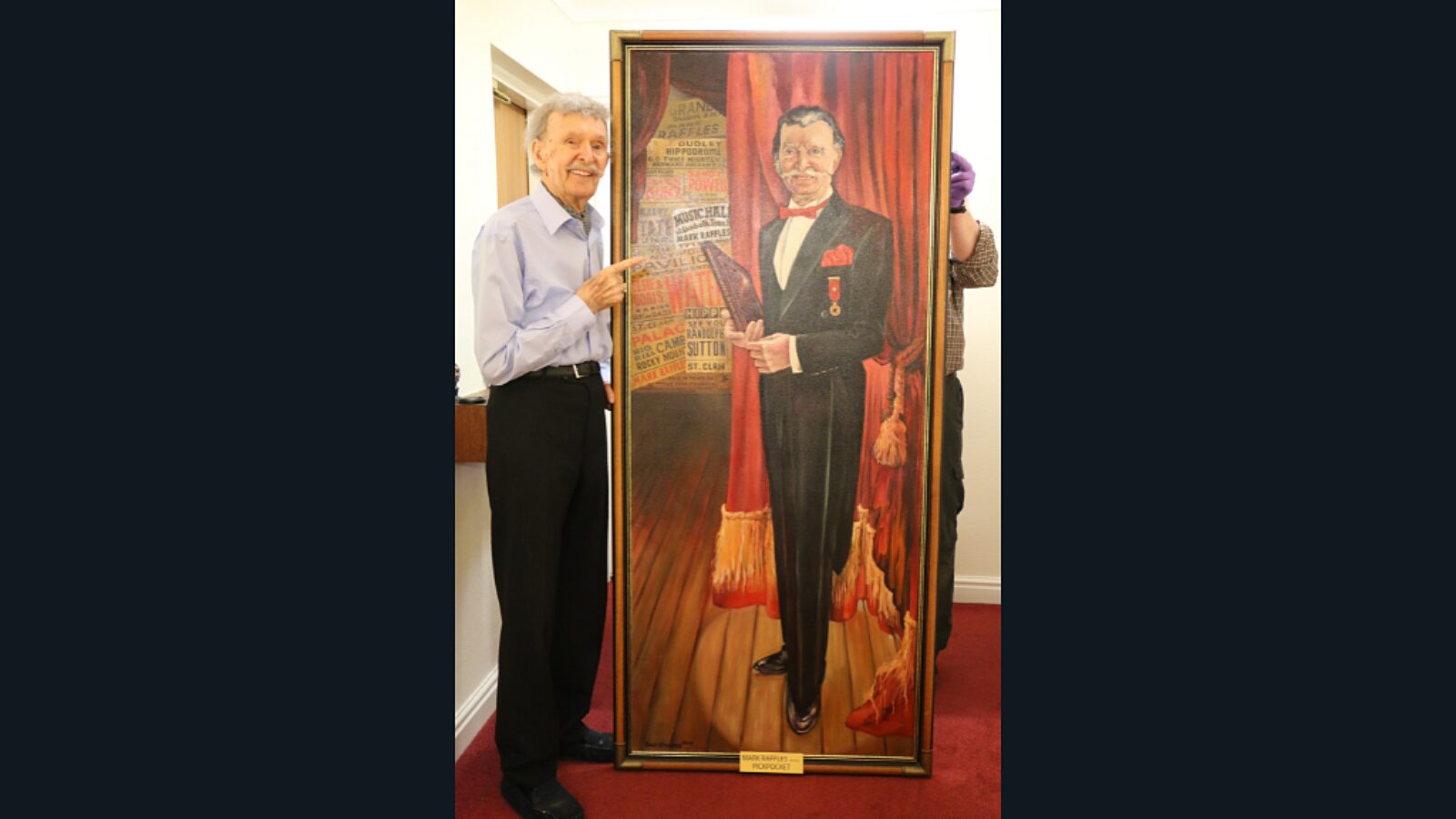 Mark Raffles with portrait of himself