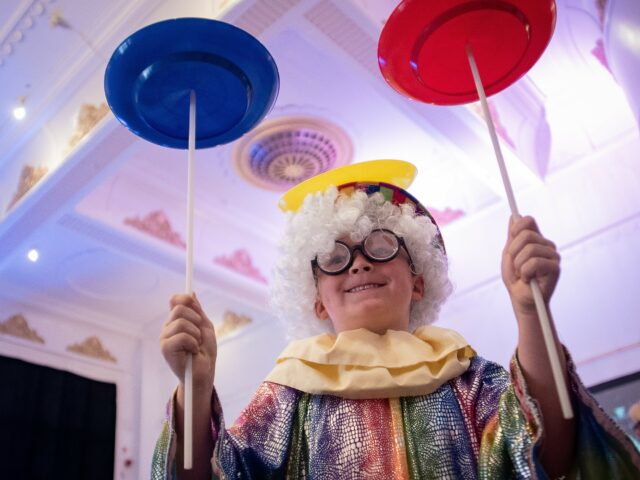 Child playing in circus costume