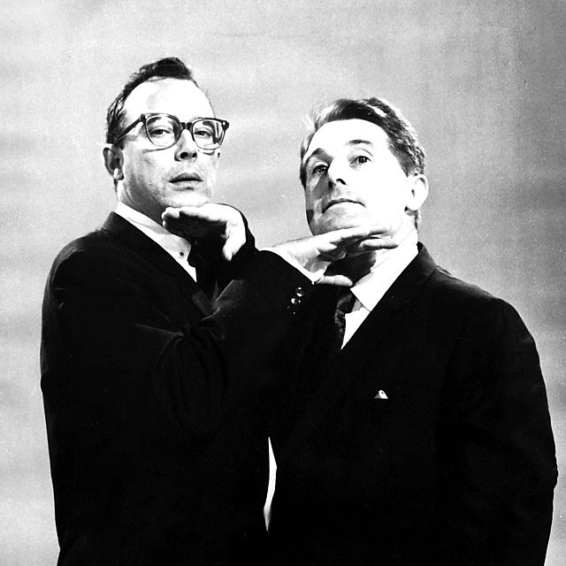 Image of Morecombe and Wise posing with their hands under their chin
