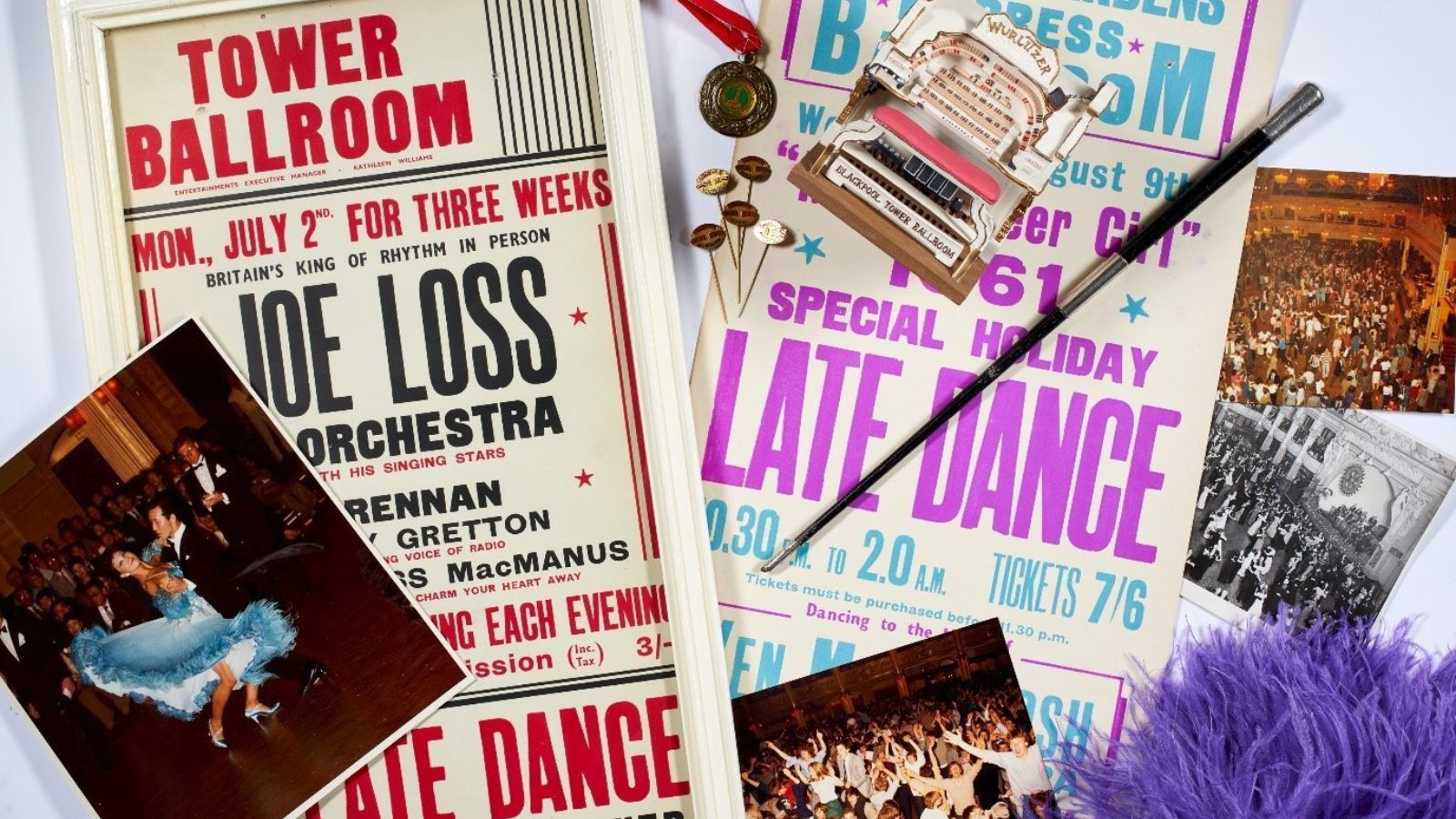 A photograph of dance objects with a tower ballroom poster, a photo of dancers and a medal