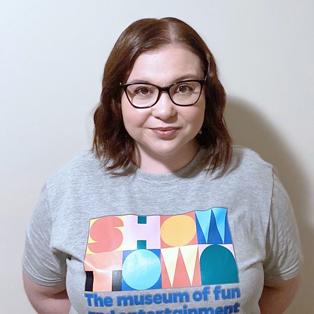 Hayley smiling, wearing a Showtown t-shirt.
