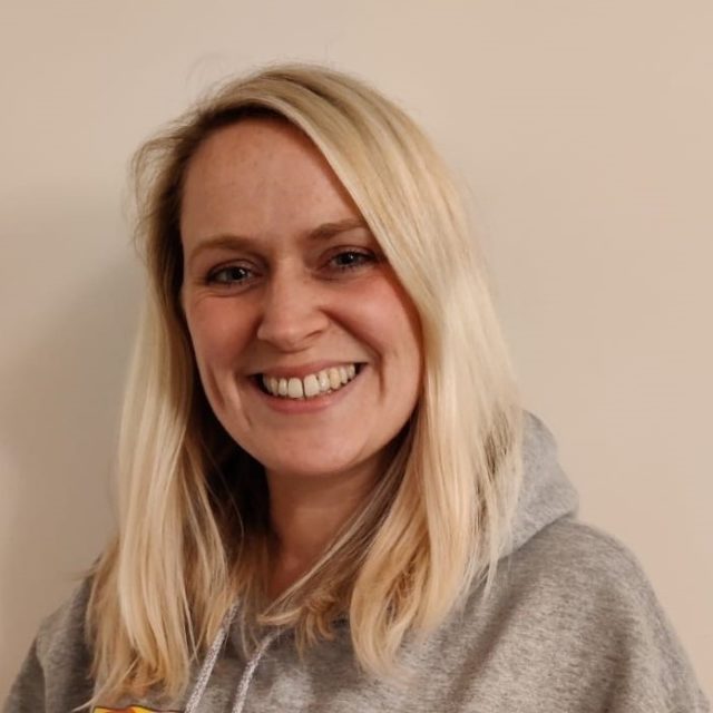 Natalie smiling wearing a Showtown hoody